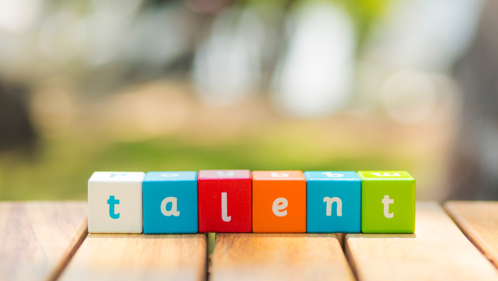 The word "talent" spelled out in toy colorful cubes